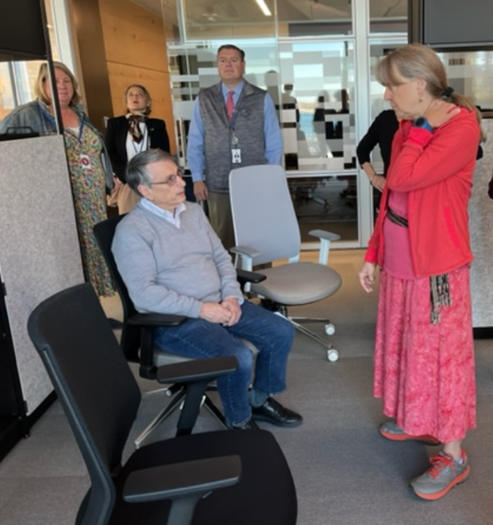 Staff and user group representatives trying out chairs at the furniture vendor showroom_2